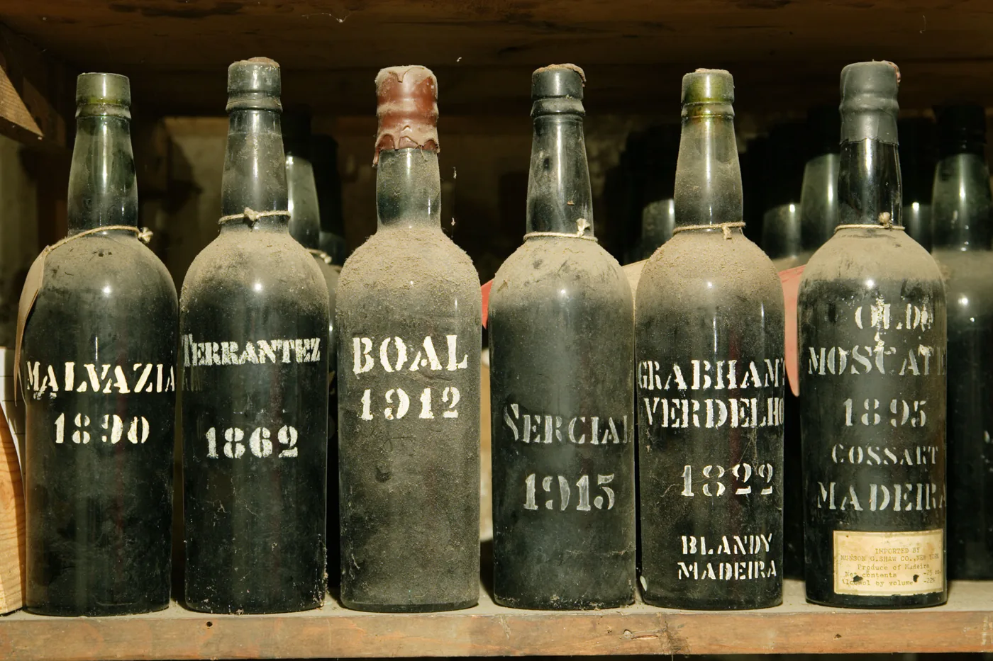 Historic bottles in a traditional Madeira wine cellar
