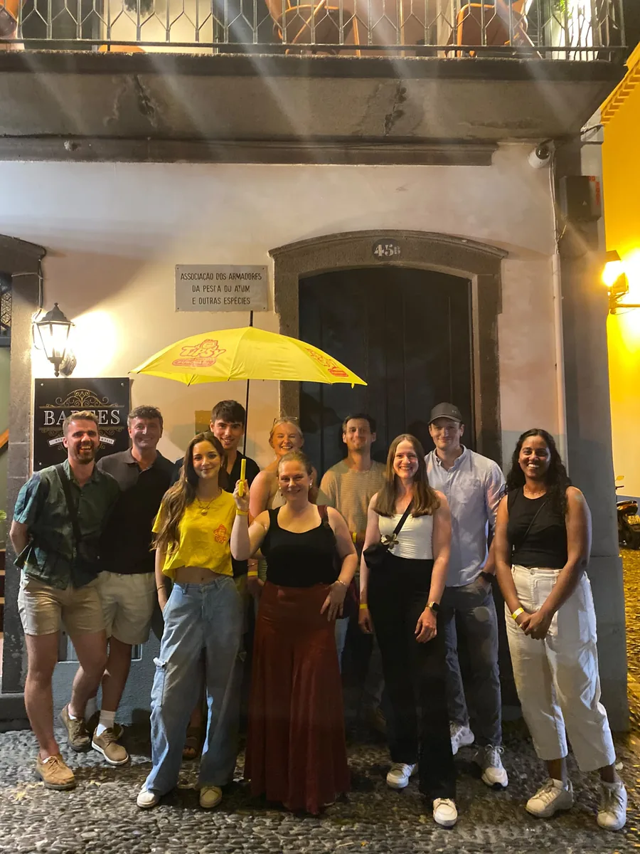 Pub crawl group enjoying a guided night out in Funchal